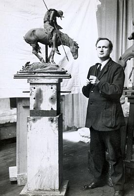 James Earle Fraser in his studio with a clay maquette of the End of the Trail sculpture, ca. 1910.