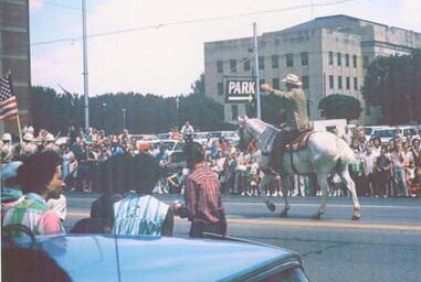 John Wayne leads parade